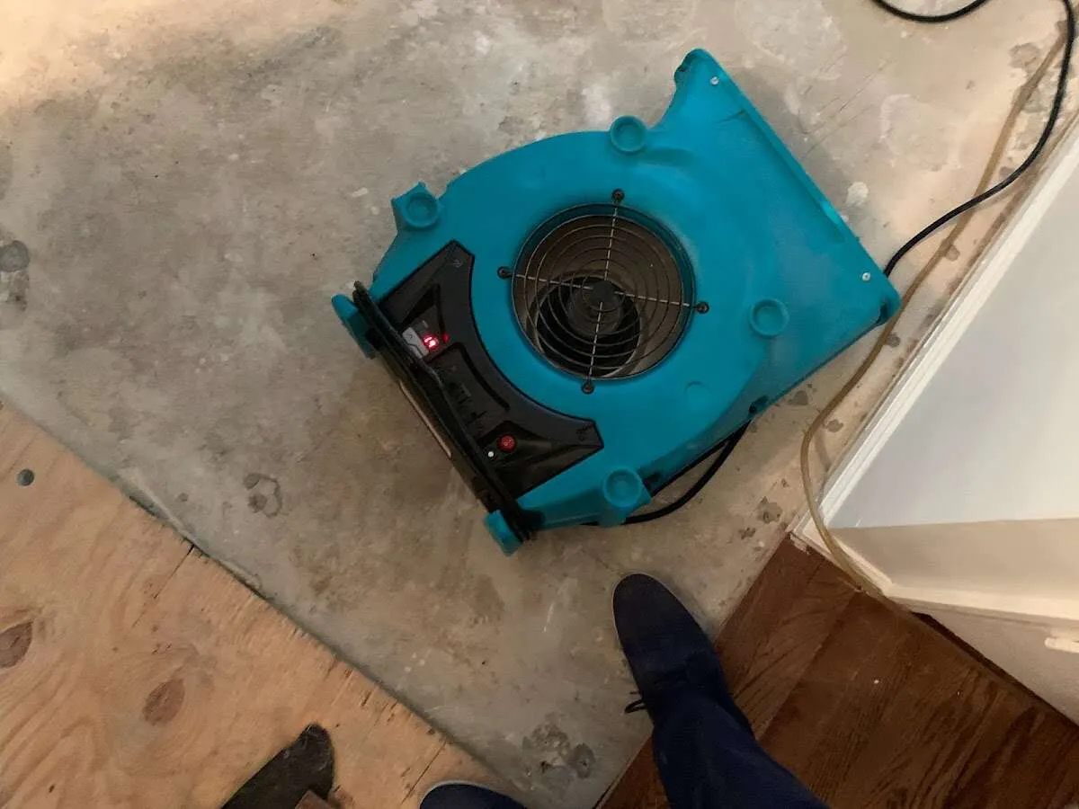 Air mover drying subfloor during Commercial Water Damage Restoration in Flowood